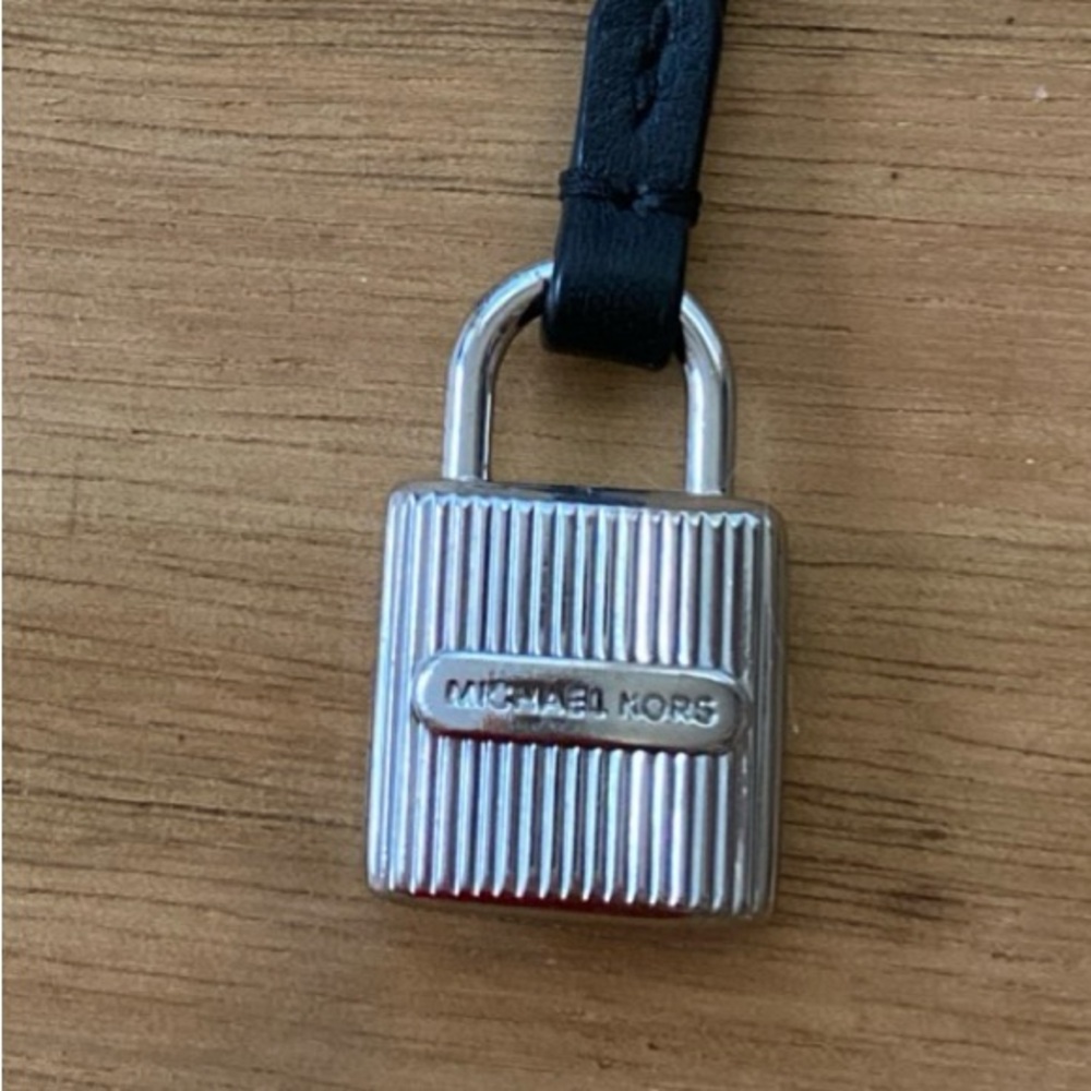 Michael Kors silver tone metal, black color strap in great condition